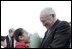 Arriving in Shanghai, Vice President Cheney is greeted by 10-year-old Lu Chi at Hong Qiao airport April 14, 2004. 