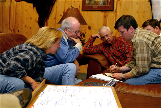 Vice President Dick Cheney reviews election returns with his daughter Mary Cheney, left, friend Dutch Bansbach, center, and aide Brian McCormack in South Dakota Tuesday, Nov. 5. White House Photo by David Bohrer.