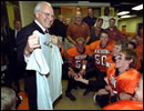 Moments before the dedication ceremony of the Cheney Alumni Field, Vice President Dick Cheney talks with the Natrona County High School football team in the locker room in Casper, Wyo., Sept. 20, 2002.