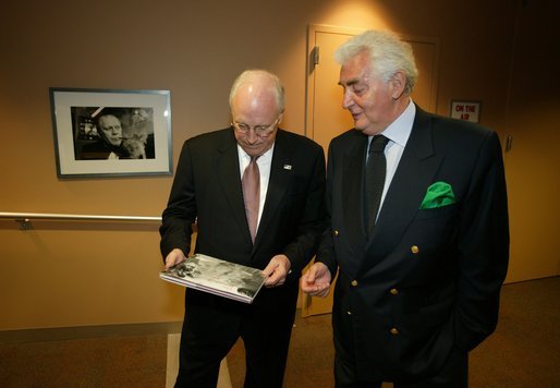 Vice President Dick Cheney looks at photographer Harry Benson's book, "The President and Mrs. Reagan: An American Love Story," after touring Mr. Benson's (right) photography exhibit "First Families: Intimate Portraits from the Kennedys to the Clintons" at Southern Methodist University's Umphrey Lee Center in Dallas Tuesday, May 6, 2003. White House photo by David Bohrer.