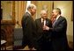After casting the deciding vote for Congressional approval of a $350 billion jobs and growth package, Vice President Dick Cheney talks with Secretary of the Treasury John Snow, left, and Secretary of Commerce Don Evans in his Senate office at the U.S. Capitol Friday, May 23, 2003. White House photo by David Bohrer.