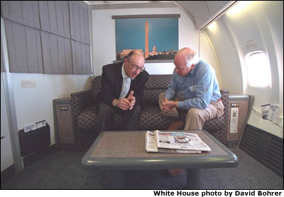 Aboard Air Force Two, Vice President Cheney and Chairman of the Federal Reserve Board Alan Greenspan talk. White House photo by David Bohrer.