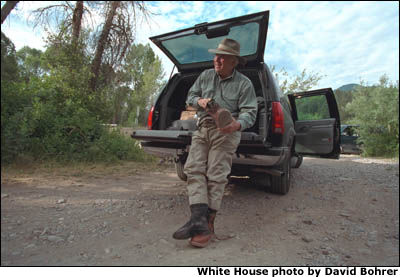 Miles away from anywhere, the Vice President trades in suits for boots and ties for fishing line. White House photo by David Bohrer.