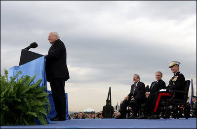 President George W. Bush, Secretary of Defense Donald Rumsfeld, and Chairman of the Joint Chiefs of Staff General Peter Pace laugh as Vice President Dick Cheney makes a joke during his remarks at the Armed Forces Full Honor Review in Honor of Secretary of Defense Donald Rumsfeld at the Pentagon, Friday, December 15, 2006.