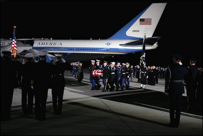 A military honor guard carries the casket of former President Gerald R. Ford upon arrival to Andrews Air Force Base in Maryland for the State Funeral ceremonies at the U.S. Capitol, Saturday, December 30, 2006.