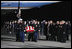 Vice President Dick Cheney leads the group of honorary pallbearers in saluting the casket of former President Gerald R. Ford upon its arrival at Andrews Air Force Base in Maryland, Saturday, December 30, 2006, for the State Funeral ceremonies at the U.S. Capitol.