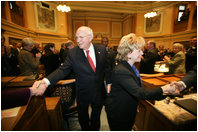 Vice President Dick Cheney and Mrs. Lynne Cheney shake hands with members of the Wyoming State Legislature as they depart the State Capitol, Friday, February 17, 2006.