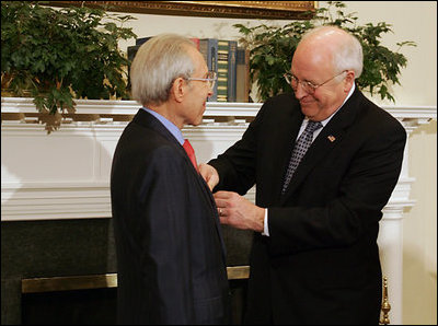 Vice President Dick Cheney presents the Distinguished Service Cross to Lieutenant Bernard W. Bail in the Roosevelt Room at the White House, Friday, February 24, 2006. The Distinguished Service Cross is awarded to a person who while serving in any capacity with the U.S. Army distinguished himself or herself by extraordinary heroism. After Lt. Bail’s aircraft took heavy anti-aircraft fire that killed the pilot and wounded other crew members over the English Channel on June 5, 1944, Lt. Bail displayed such acts of valor and ultimately prevented the aircraft, loaded with a full ordnance, from crashing into an English village.