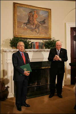 Vice President Dick Cheney applauds Lieutenant Bernard W. Bail, recipient of the Distinguished Service Cross, in the Roosevelt Room at the White House, Friday, February 24, 2006. The Vice President awarded the Distinguished Service Cross to Lt. Bail for his extraordinary acts of heroism during World War II and commended Lt. Bail for being a "brave citizen who elevated service to country above self interest."