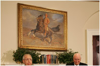 Vice President Dick Cheney applauds Lieutenant Bernard W. Bail, recipient of the Distinguished Service Cross, in the Roosevelt Room at the White House, Friday, February 24, 2006. The Vice President awarded the Distinguished Service Cross to Lt. Bail for his extraordinary acts of heroism during World War II and commended Lt. Bail for being a "brave citizen who elevated service to country above self interest."