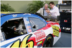Vice President Dick Cheney is shown the National Guard NASCAR racing car by former NASCAR driver and Winston Cup champion Darrell Waltrip Saturday, July 1, 2006, prior to the start of the 2006 Pepsi 400 race at Daytona International Speedway in Daytona, Fla.