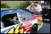 Vice President Dick Cheney is shown the National Guard NASCAR racing car by former NASCAR driver and Winston Cup champion Darrell Waltrip Saturday, July 1, 2006, prior to the start of the 2006 Pepsi 400 race at Daytona International Speedway in Daytona, Fla.