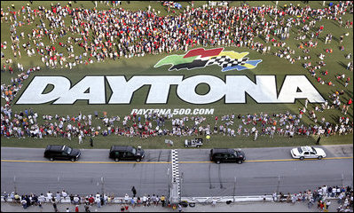 The motorcade of Vice President Dick Cheney takes a lap around the Daytona International Speedway in Daytona, Fla., Saturday, July 1, 2006, before the start of the 2006 Pepsi 400 NASCAR race.