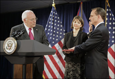 Vice President Dick Cheney swears in Steven Preston as the Administrator of the Small Business Administration during a ceremony at the Offices of the Small Business Administration in Washington, D.C., Wednesday, July 26, 2006. Preston’s wife, Molly, holds the Bible.