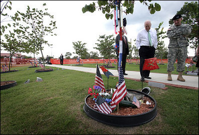 Vice President Dick Cheney tours the “Warriors Walk,” a living memorial of Eastern Redbud trees dedicated to the fallen soldiers assigned to the 3rd Infantry Division who served in Operation Iraqi Freedom, as part of his visit to Fort Stewart, Ga., Friday, July 21, 2006.