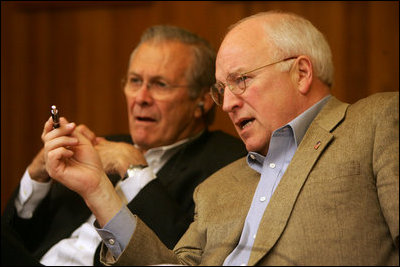 Vice President Dick Cheney talks with Secretary of Defense Donald Rumsfeld during a video teleconference from Camp David, Md. with President Bush and Iraqi Prime Minister Nouri al-Maliki in Baghdad, Tuesday, June 13, 2006.