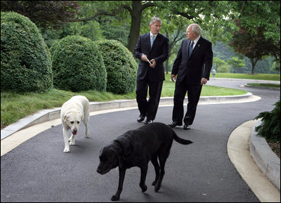Vice President Dick Cheney is joined by his dogs Dave, left, and Jackson, right, during an interview with John King of CNN, Thursday, June 22, 2006, at the Vice President’s Residence at the Naval Observatory in Washington D.C.
