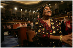 Liberian President Ellen Johnson-Sirleaf is welcomed by a Joint Meeting of Congress as she makes her way to the rostrum of the House Chamber before her remarks at the Capitol, Wednesday, March 15, 2006. President Johnson-Sirleaf is the first democratically elected female president of an African country and won Liberia’s November 2005 presidential elections with a margin of almost 20% of the vote.