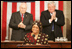Vice President Dick Cheney and House Speaker J. Dennis Hastert applaud Liberian President Ellen Johnson-Sirleaf during an address to a Joint Meeting of Congress, Wednesday, March 15, 2006. The President’s speech marked the beginning of a multi-day trip to Washington that will include meetings with US officials in an effort to garner support as she leads her country in economic reconstruction and reform.