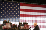 Vice President Dick Cheney thanks troops and their families for their efforts in the global war on terror during remarks delivered at Scott Air Base in Illinois, Tuesday, March 21, 2006. Scott Air Base is the home of the US Transportation Command (USTRANSCOM), which coordinates worldwide transportation efforts using both military and commercial resources. During an average week, USTRANSCOM conducts more than 1,900 air missions and 10,000 ground shipments in 75 percent of the world's countries.