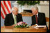 Vice President Dick Cheney listens to Lithuanian President Valdus Adamkus during a bilateral meeting held at the Presidential Palace in Vilnius, Lithuania, Wednesday, May 3, 2006. During the meeting the two leaders discussed their mutual determination to further the rise of democracy in the region.