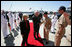Vice President Dick Cheney and his wife Lynne Cheney is greeted by officers from the amphibious assault ship USS Bonhomme Richard. The Vice president spoke to over 4,000 sailors and Marines and thanked them and their families for their service to the country.