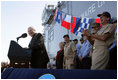 Vice President Dick Cheney gets a laugh from Navy commanders on stage as he makes a joke during an address to over 4,000 sailors and Marines from the flight deck of the amphibious assault ship USS Bonhomme Richard docked at Naval Station San Diego.