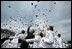 Graduates celebrate by throwing their caps into the air at the conclusion of the Graduation and Commissioning Ceremony for the U.S. Naval Academy Class of 2006, Friday, May 26, 2006 in Annapolis, Maryland.