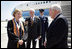 Upon landing in Louisana, Vice President Dick Cheney talks with Louisiana State University Student Body President Michelle Gieg and Chancellor Sean O'Keefe alongside Air Force Two. The Vice President delivered the commencement address to over 3,000 bachelors, masters, and doctoral students.
