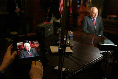 Vice President Dick Cheney is seen on a TV monitor during a radio and television interview with Sean Hannity of FOX News in the Vice President's Ceremonial Office, Tuesday, October 24, 2006.