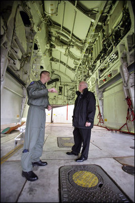 Vice President Dick Cheney stands in the bomb bay of a B-2 Stealth bomber with Lt. Col. Bill Eldridge, left, during a tour at Whiteman Air Force Base, Missouri, Friday, October 27, 2006.