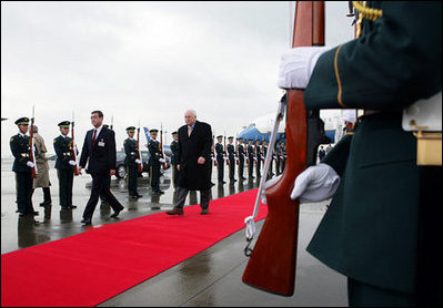 Vice President Dick Cheney walks the red carpet upon his arrival to Haneda International Airport in Tokyo, Tuesday, February 20, 2007. The Vice President is scheduled to meet senior Japanese officials and visit U.S. military personnel before traveling to Australia later in the week.