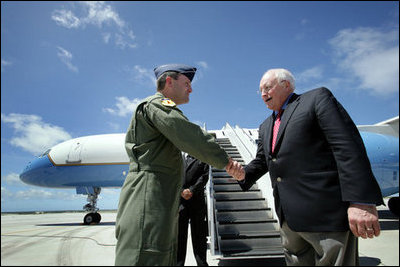 Vice President Dick Cheney is greeted by Brigadier General Doug Owens, Commander, 36th Wing, Thursday, Feb. 22, 2007, upon arrival to Andersen Air Force Base, Guam, for a rally with U.S. troops.