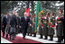 Vice President Dick Cheney and Afghan President Hamid Karzai review an honor guard, Tuesday, Feb. 27, 2007 during the Vice President's arrival to the presidential palace in Kabul.