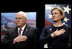 Vice President Dick Cheney stands with Susan Ford Bales, daughter of former President Gerald R. Ford, while the U.S. national anthem is played during the naming ceremony for the new U.S. Navy aircraft carrier, the USS Gerald R. Ford, at the Pentagon in Washington, D.C., Tuesday, Jan. 16, 2007. The nuclear-powered vessel will go into service in 7-8 years and will be the first in the new Gerald R. Ford class of aircraft carriers in the U.S. Navy.