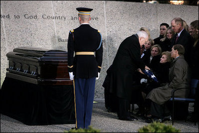 Vice President Dick Cheney and Mrs. Lynne Cheney salute as the casket of former President Gerald R. Ford is carried by a military honor guard during interment ceremonies on the grounds of the Gerald R. Ford Presidential Museum in Grand Rapids, Mich., Wednesday, January 3, 2007.