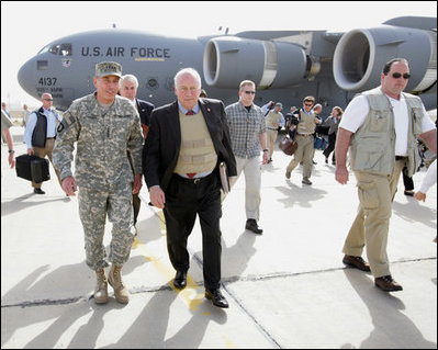 Vice President Dick Cheney walks with General David Petraeus, Commander of U.S. forces in Iraq, upon arrival to Baghdad Wednesday, May 9, 2007. The Vice President began a trip to the Middle East with an unannounced visit to Iraq to meet with Iraqi officials and U.S. leadership. 