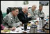 Vice President Dick Cheney participates in a classified briefing Thursday, May 10, 2007, with U.S. commanders General David Petraeus, left, and Lieutenant Generals Raymond Odierno and Stanley McChrystal during a visit to Contingency Operating Base Speicher near Tikrit, Iraq. 