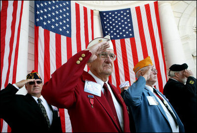Veteran Warren G. King, Sr. of Nashville, center, salutes with fellow veterans Sunday, Nov. 11, 2007, during Veteran's Day ceremonies at Arlington National Cemetery in Arlington, Va.