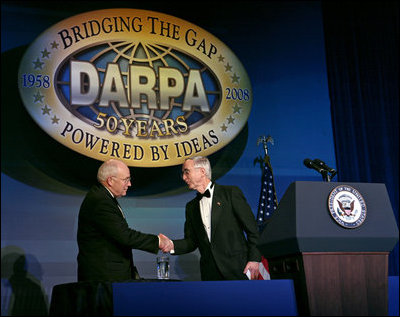 Vice President Dick Cheney is welcomed by Deputy Secretary of Defense Gordon England Thursday, April 10, 2008, to deliver the keynote speech at the the Defense Advanced Research Projects Agency 50th anniversary celebration in Washington, D.C. The Vice President congratulated DARPA on its history of achieving significant technological breakthroughs to aid in U.S. defense and national security.