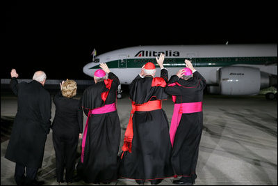 Vice President Dick Cheney and Mrs. Lynne Cheney are joined by clergy as they wave to the departing Alitalia airliner carrying Pope Benedict XVI from JFK Airport Sunday, April 20, 2008, in New York. The Pope later landed safely in Rome, capping a six-day visit to the United States.