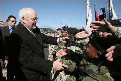 Vice President Dick Cheney shakes the outstretched hands of soldiers Tuesday, Feb. 26, 2008, following a rally for the troops at Fort Hood, Texas, home of the U.S. Army's First Cavalry Division.