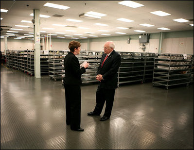 Marking the first day of mass production of economic stimulus checks, Vice President Dick Cheney tours the Philadelphia Regional Financial Center with Director Betty Belinsky, Thursday, May 8, 2008, in Philadelphia.