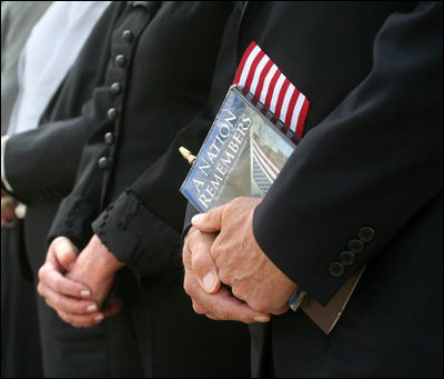 Vice President Dick Cheney is seen holding a flag and a commemorative program during the dedication ceremony of the 9/11 Pentagon Memorial Thursday, Sept. 11, 2008, at the Pentagon in Arlington, Va.