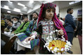 Local children participate in the opening session of the Afghan Parliament, the first elected parliament in more than three decades, in Kabul, Afghanistan Monday, Dec. 19, 2005.
