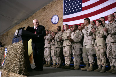 Vice President Dick Cheney receives a welcome from the troops at a rally at Bagram Air Base, Afghanistan Monday, Dec. 19, 2005.