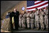 Vice President Dick Cheney receives a welcome from the troops at a rally at Bagram Air Base, Afghanistan Monday, Dec. 19, 2005.