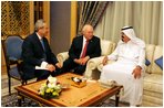 Vice President Dick Cheney speaks with newly crowned King Abdullah during a retreat at King Abdullah's Farm in Riyadh, Saudi Arabia Friday, August 5, 2005, following the death of his half-brother King Fahd who passed away August 1, 2005. Interpreter Gamal Helal, center, is also pictured.