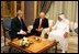 "Vice President Dick Cheney speaks with newly crowned King Abdullah during a retreat at King Abdullah's Farm in Riyadh, Saudi Arabia Friday, August 5, 2005, following the death of his half-brother King Fahd who passed away August 1, 2005. Interpreter Gamal Helal, center, is also pictured. "