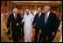 "Vice President Dick Cheney walks with newly crowned King Abdullah, former President George H.W. Bush, and former Secretary of State Colin Powell during a retreat at King Abdullah's Farm in Riyadh, Saudi Arabia Friday, August 5, 2005, following the death of Abdullah's half-brother King Fahd who passed away August 1, 2005. "